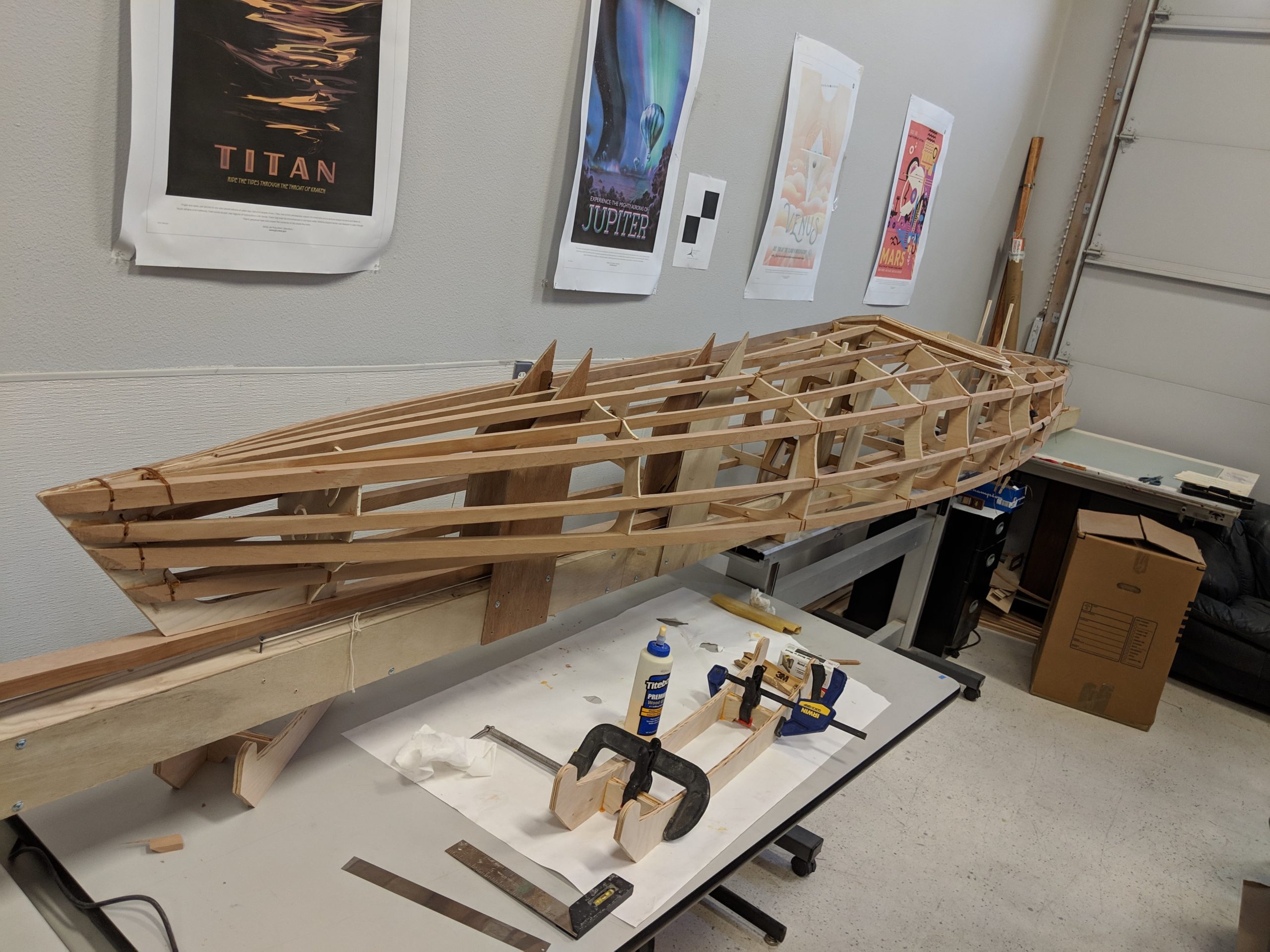 The wooden framework of Bob's full 17-foot kayak at Anchorage MakerSpace.