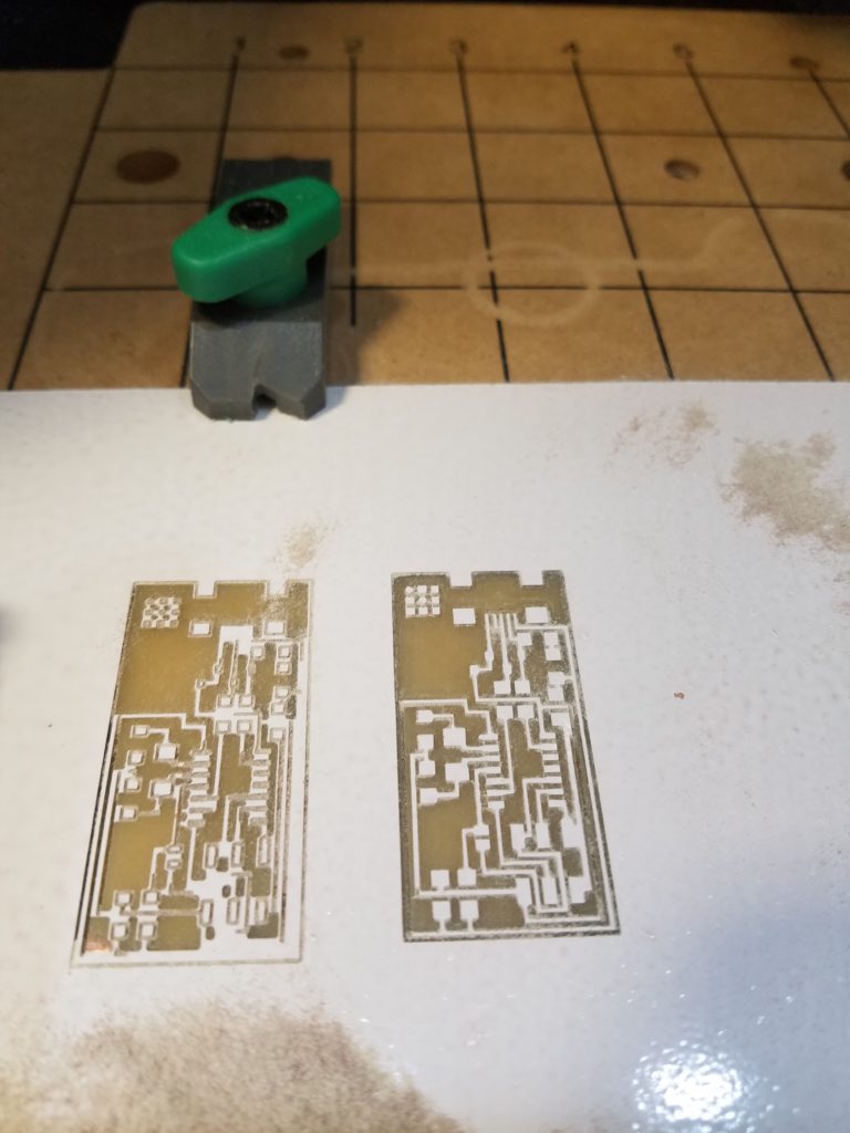 White micro circuit boards milled from a micro CNC.