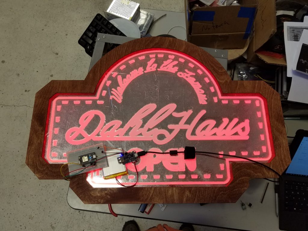 The finished Dahl Haus sign—complete with the birch frame, red LEDs, and wire backing (not shown).